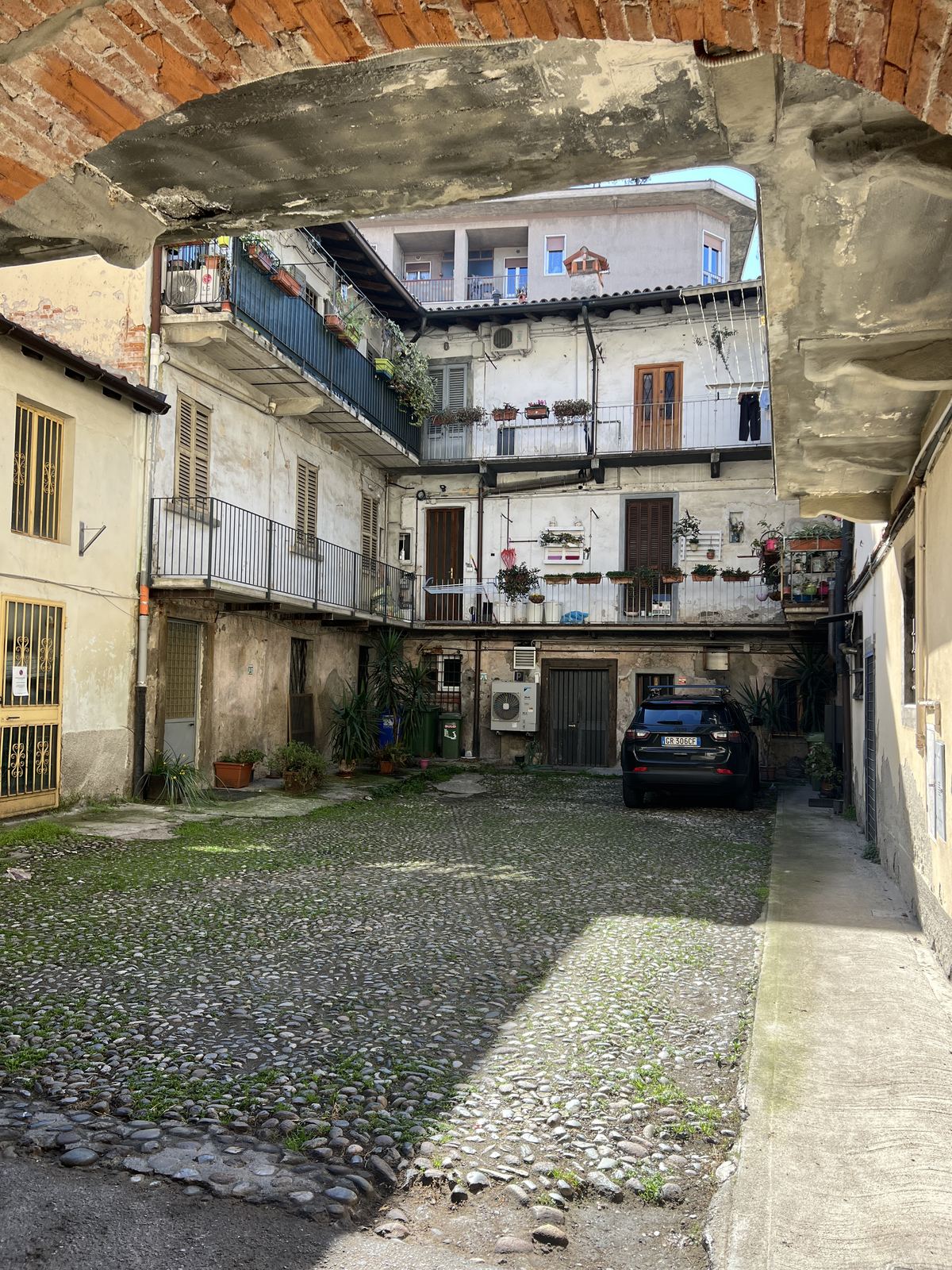 Cobbled courtyard through the archway